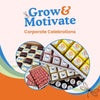Branded “Grow & Motivate” petit fours in black, white, and yellow designs.